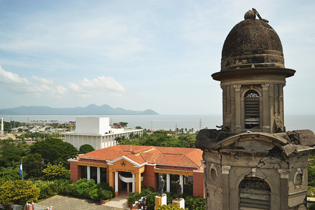 Cathedral old tower in Managua with city and lake in backgroundの写真素材