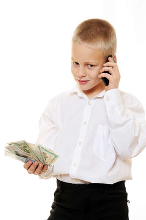 kid boy boss with phone and money isolated whiteの写真素材