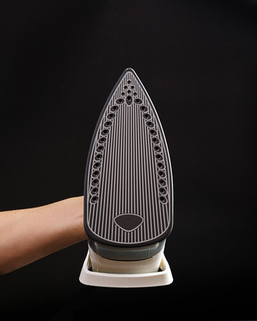 bottom of iron isolated on black backgroundの写真素材