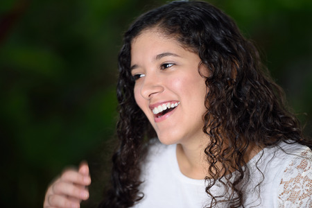 teen girl laughing so muchの写真素材