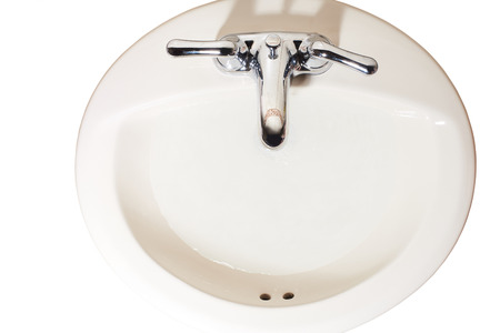 isolated top sink with water drops in bathroomの写真素材