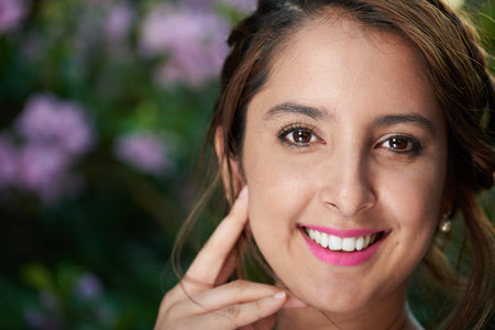 close up portrait of woman in floswe park with spaceの写真素材
