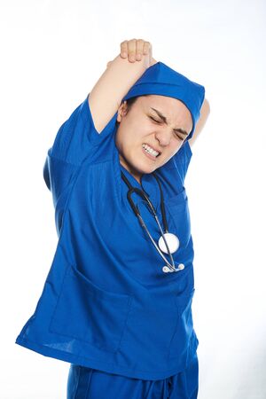 female tired with backpain and stretching on a white backgroundの写真素材