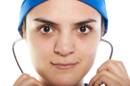 close up of female surgeon with stethoscope