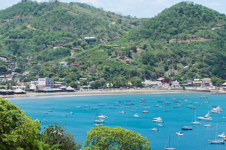 bay with blue water and boat on summer day