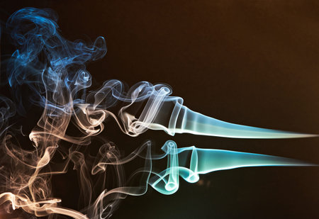 smoke curves colourful on brown backgroundの写真素材