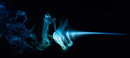 magic blue colourful smoke curves on blackの写真素材