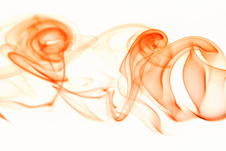 orange smoke swirl isolated on white backgroundの写真素材