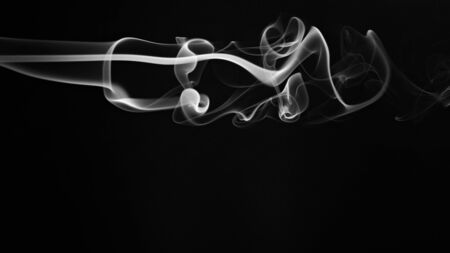 abstract white smoke lines isolated on blackの写真素材