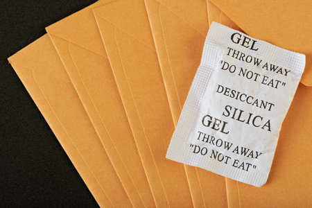 silica gel package lay on yellow envelop