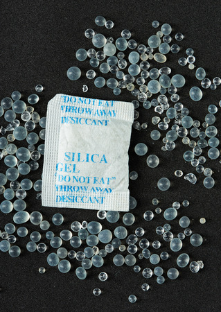 pack of silica gel with silica balls in black backgroundの写真素材