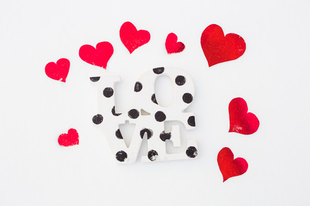 Red hearts and love on white snow isolatedの写真素材