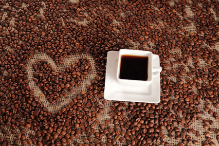 Coffee love from brown coffee beans view from topの写真素材