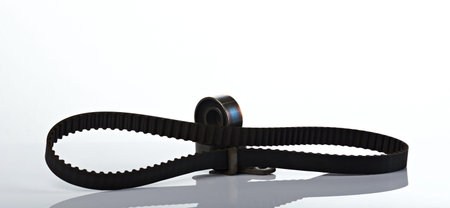 car spare parts belt and roller isolated on whiteの写真素材