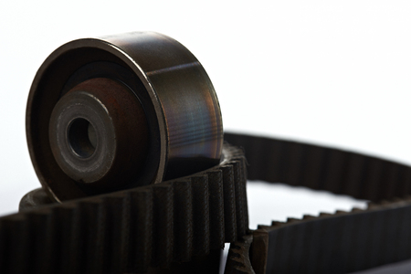 one roller on timing belt isolated on whiteの写真素材