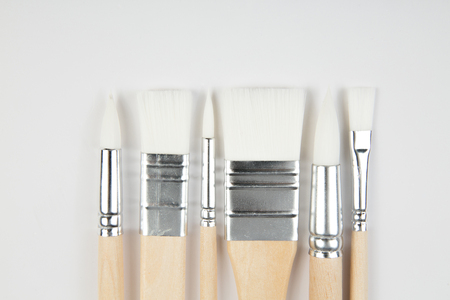 White paintbrushes with wooden handle on clear backgroundの写真素材