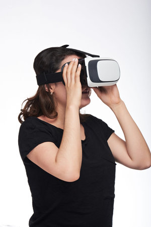Young women in VR glasses isolated on white background