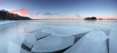 Winter panorama of frozen lake in the morning.