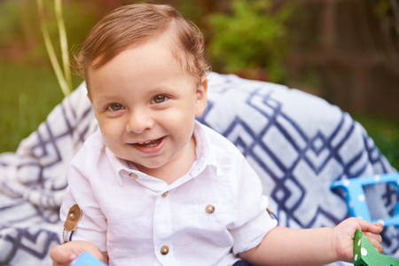 Portrait of little smiling boy with brown hairの写真素材