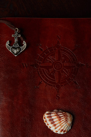 Adventure book leather cover with ancor and sea shellの写真素材