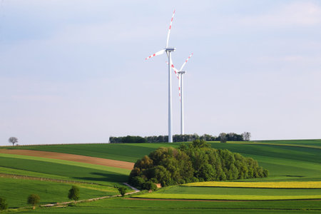 Wind power station over blue sky background. Perfect energy saver background. Alternative energy...