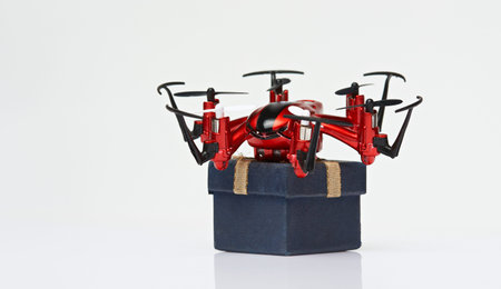 Fast air delivery via drone isolated on white background. Fly shipping service
