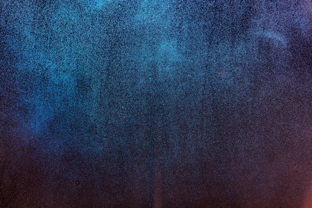 Fogged window glass background texture. Blue and orange wet glass surfaceの写真素材