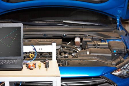 Closeup of mechanic car table on blurred vehicle background. Vehicle auto serviceの写真素材