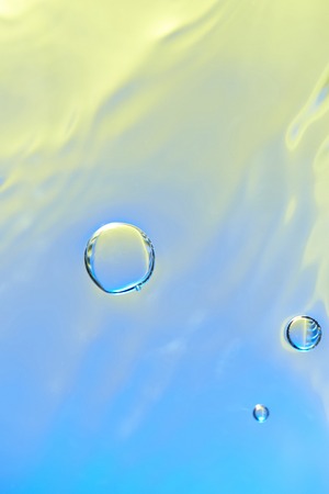 Clean and smooth water background with round air bubblesの写真素材