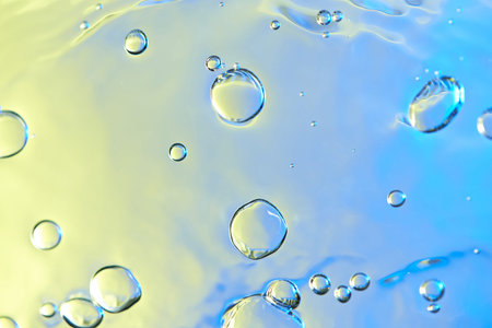 Air water bubbles abstract background. Colorful bright clear water texture with bubblesの写真素材