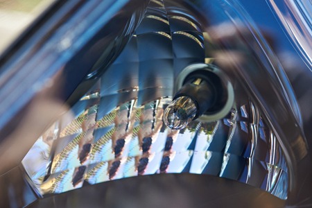 Front bulb car headlight. Macro of modern car head light bulbの写真素材