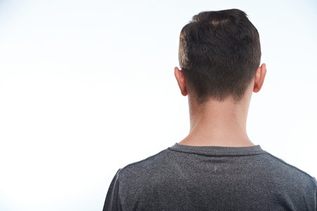 Rear view man in t-shirt close-up isolated on white background