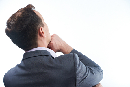 Business man think under idea. Back view of man solving problemの写真素材