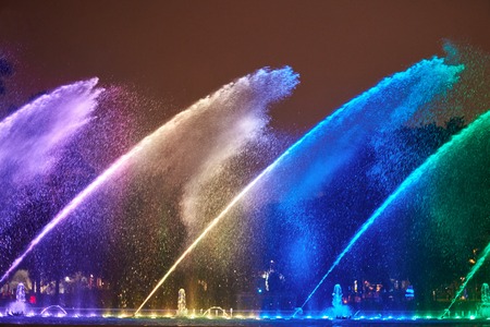 Night colorful fountain show in Lima park. Vivid color fountain waterの写真素材