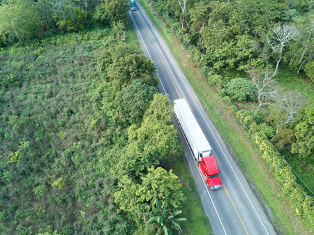 Road with truck carry container aerial above view. Transamerica road in Nicaraguaの写真素材