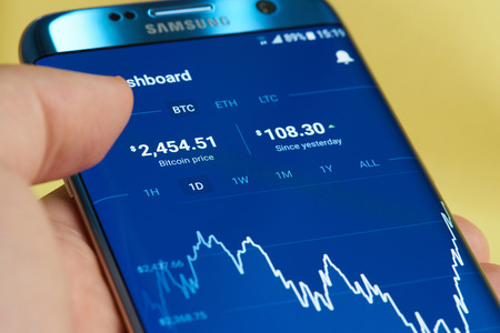 New york, USA - June 27, 2017: Bitcoin rate exchange to dollar graph. Price of one bitcoinのeditorial素材