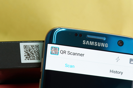 New york, USA - June 27, 2017: QR scanner mobile app close-up. Scanning product QR codeのeditorial素材