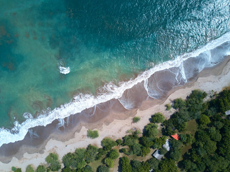 Blue sea water in coastline aerial view. Wild beach at ocean