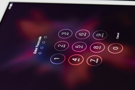 New york, USA - July 11, 2017: Digitals passcode on iphone smartphone macro. Digitals for entering password on ipad screenのeditorial素材