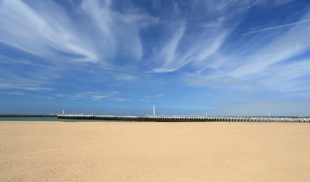 Beach on a sunny summer day. White sand under blue vibran sky.の写真素材