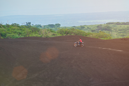 Man ride motorbike outdoor in nature parkの写真素材
