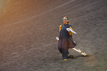 Happy girl on volcano ride tour in Nicaragua. Woman with volcano boardの写真素材