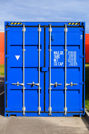 Blue cargo container on ground. Front side of cargo container.の写真素材