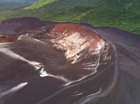 People walking on volcano crater in Nicaragua aerial drone viewの写真素材