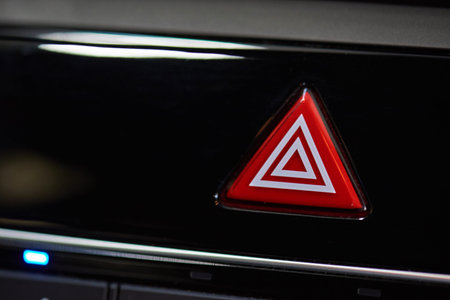 Emergency stop button on modern car interior close-up