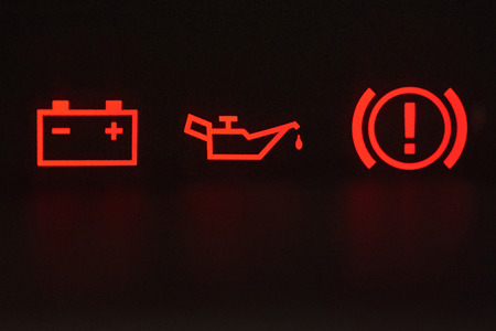 Macro of error signs in car. Red icons of battery, oil and hand breakの写真素材