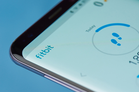 New york, USA - August 22, 2017: Fitbit application menu on smartphone screen close-up. Using fitbit appのeditorial素材