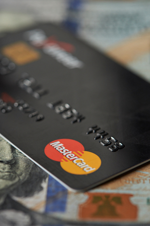 New york, USA - August 24, 2017: Debit master card lay on dollar bill backgroundのeditorial素材