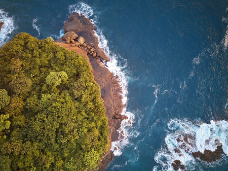Sunset in tropical island shore above aerial viewの写真素材