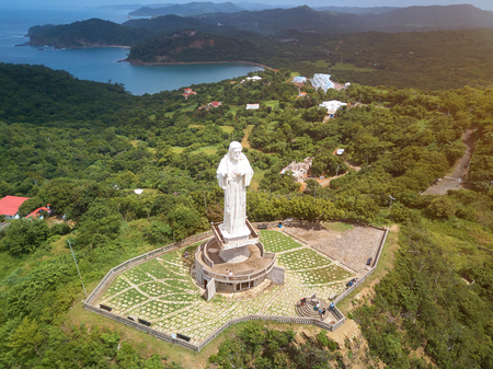 People visiting Jesus christ statue in san juan del sur nicarguaの写真素材